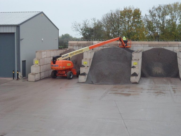 FITTING RAZOR WIRE ON TOP OF WALL FOR HOPKINS CONCRETE BRIDGWATER